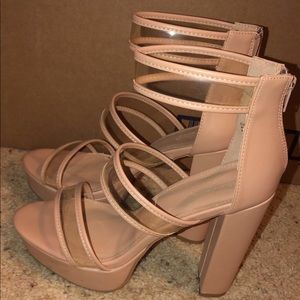 High heeled clear and nude shoes